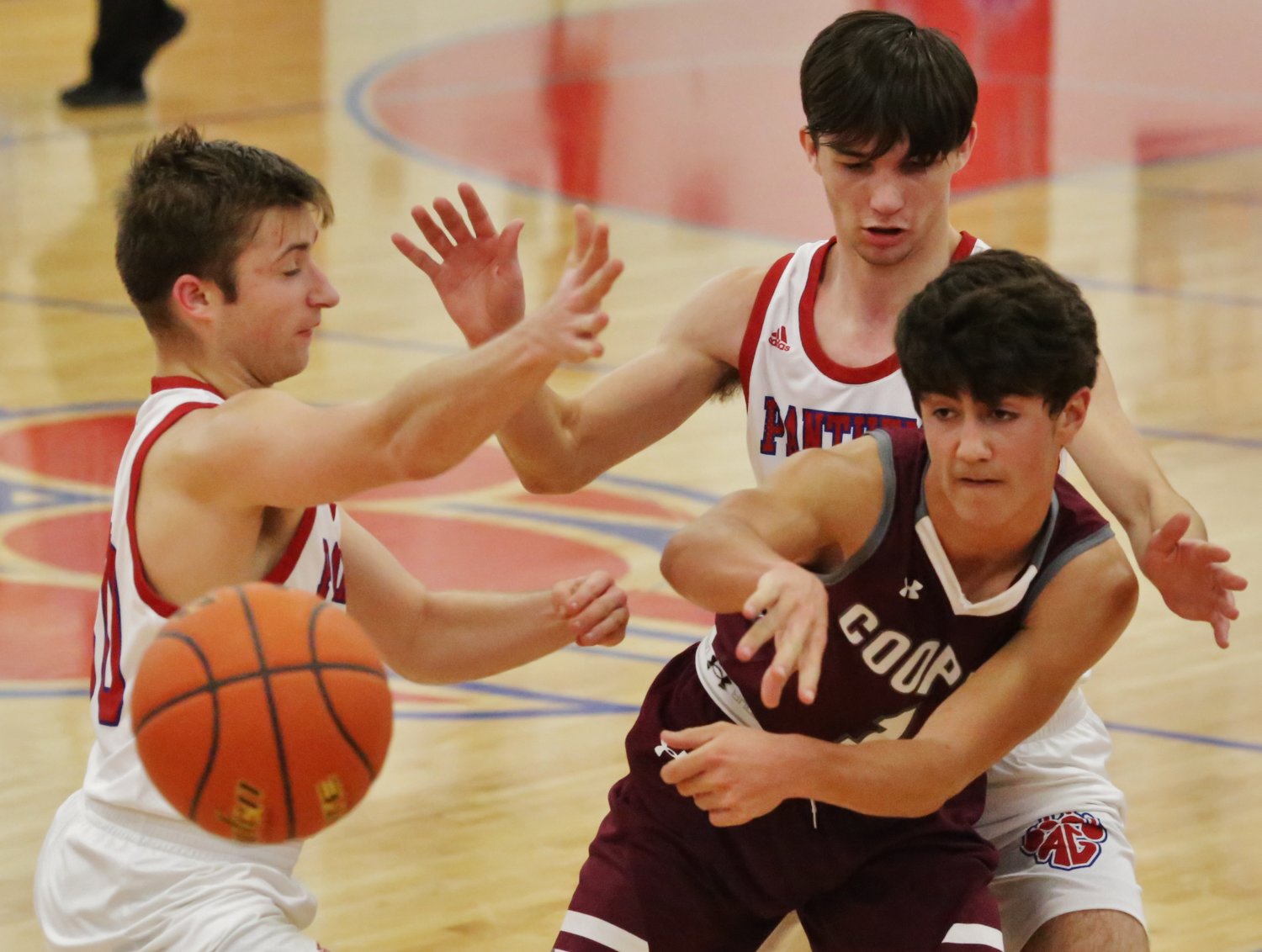 Kyle Kennedy (left) and Jack Patton apply pressure to a Cooper ball-handler late in Thursday’s game.